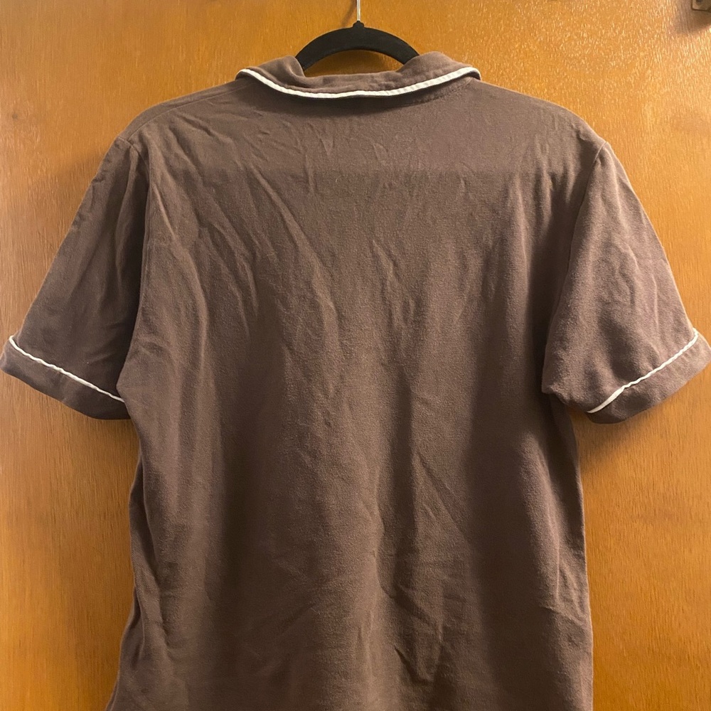 Presenting a stylish brown polo from the Original Penguin brand